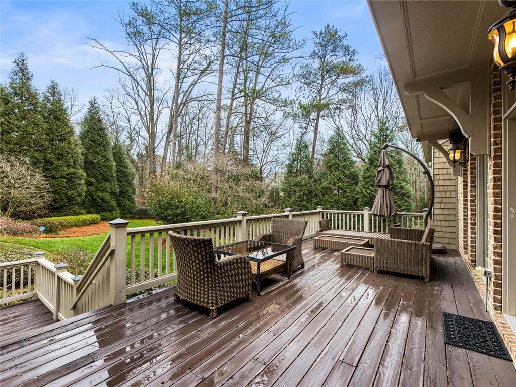 Enjoy morning coffee on the deck overlooking the manicured grounds
