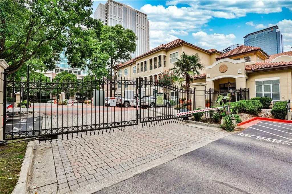 View of gate featuring fence