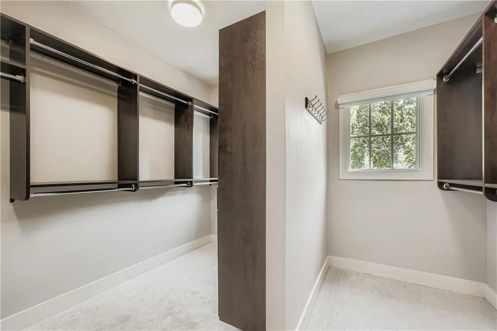 Spacious closet with carpet flooring