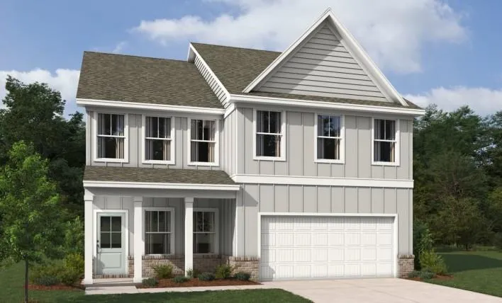 Contemporary two-story residence with light gray board and batten siding