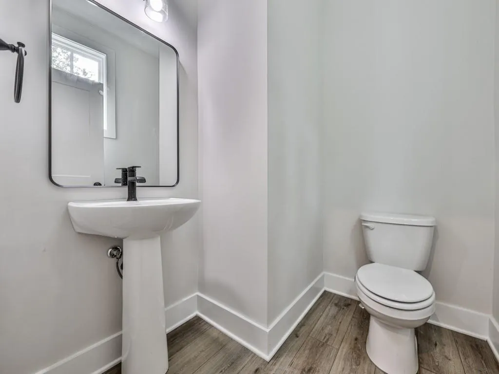 Bathroom featuring toilet and LVP floors