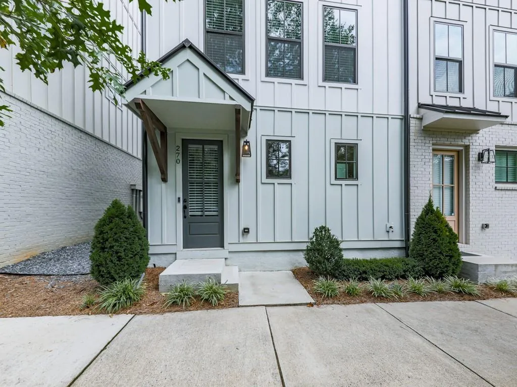 Property entrance with board and batten siding