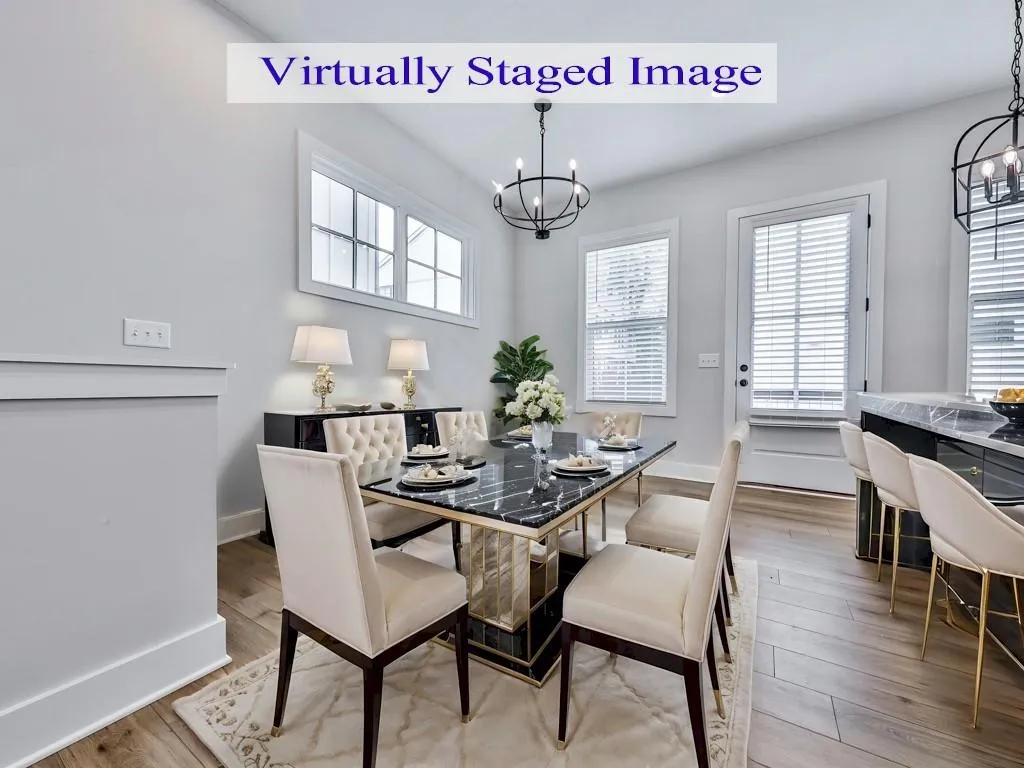 Dining room featuring a chandelier and LVP floors