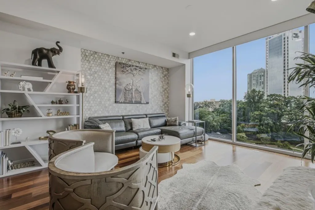 Sofa lcove provides extra space in this living room accented by gorgeous tile