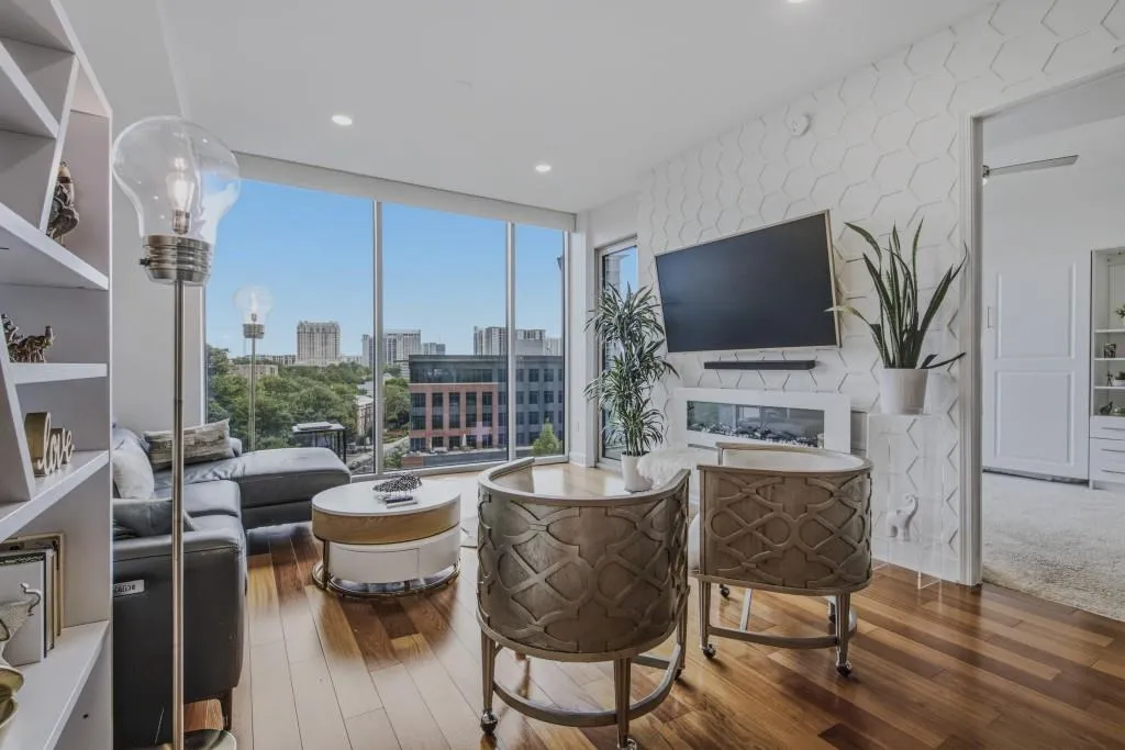 Floor to ceiling windows provide view of Buckhead.