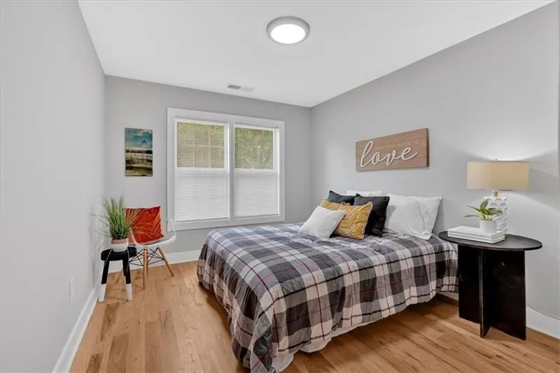 Bedroom with light wood-style floors and baseboards