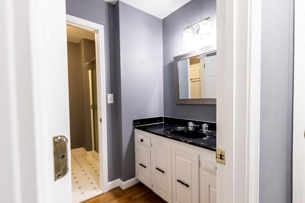 Bathroom featuring oversized vanity and tile floors