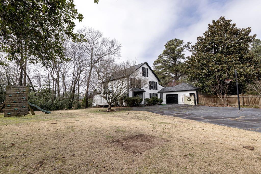 View of yard with a playground