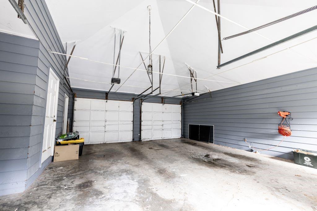 Garage featuring a garage door opener