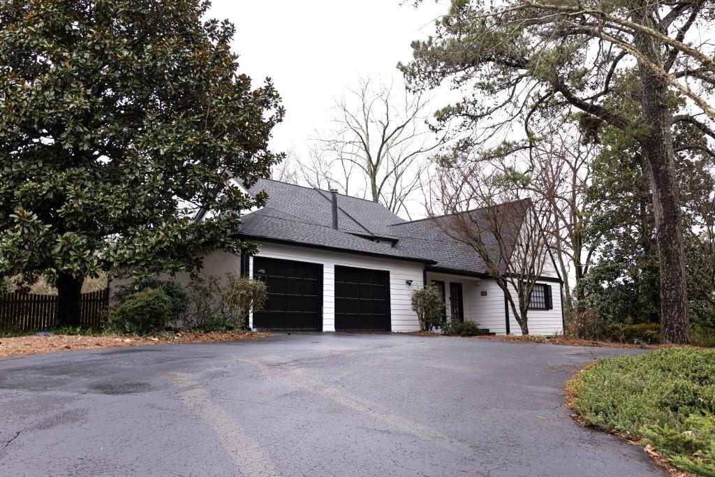 View of property exterior with a garage