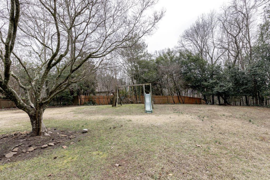 View of yard featuring a playground