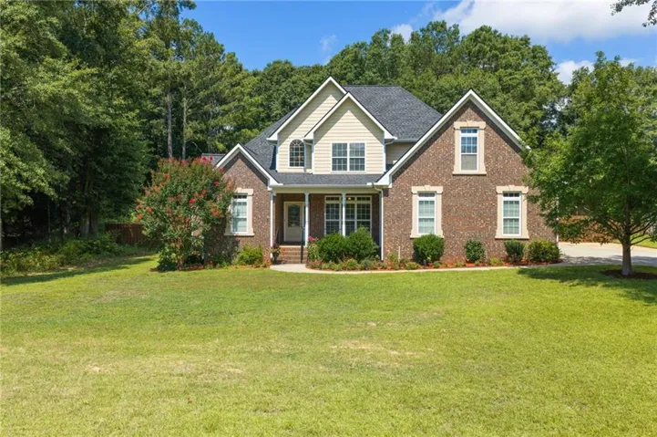 Brick and siding exterior with a gabled roof