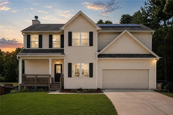 3 story residence with lush front and back yard