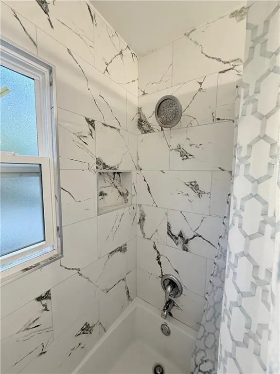 Full bathroom featuring shower / bath combination with curtain
