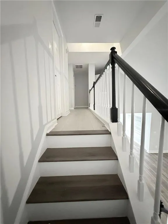 Stairway with wood finished floors