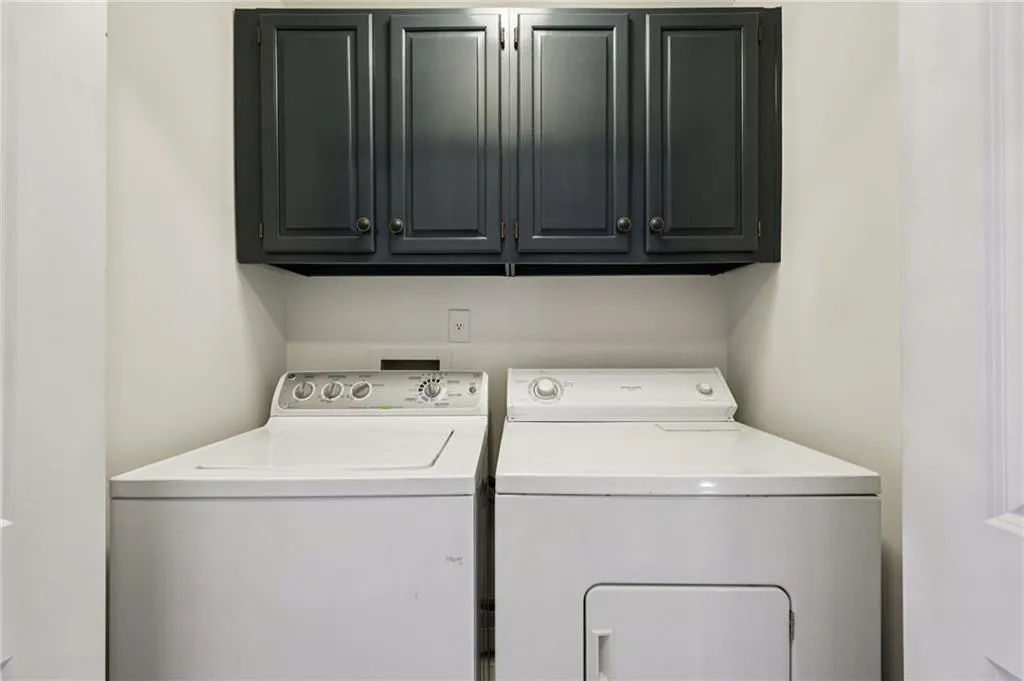 Laundry room with washer and dryer and cabinet space