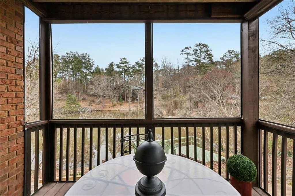 Screened in deck overlooking pond.