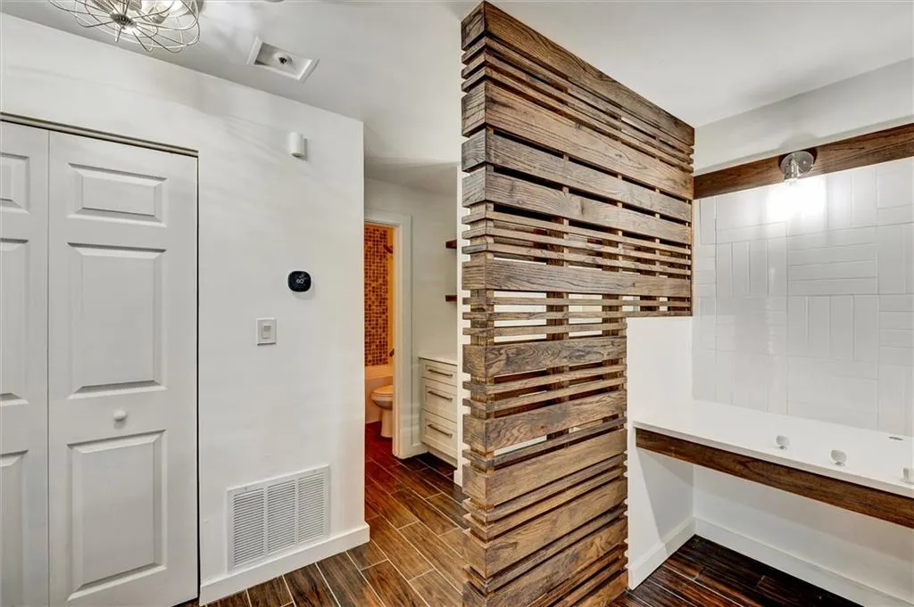 Corridor with wood tiled floors