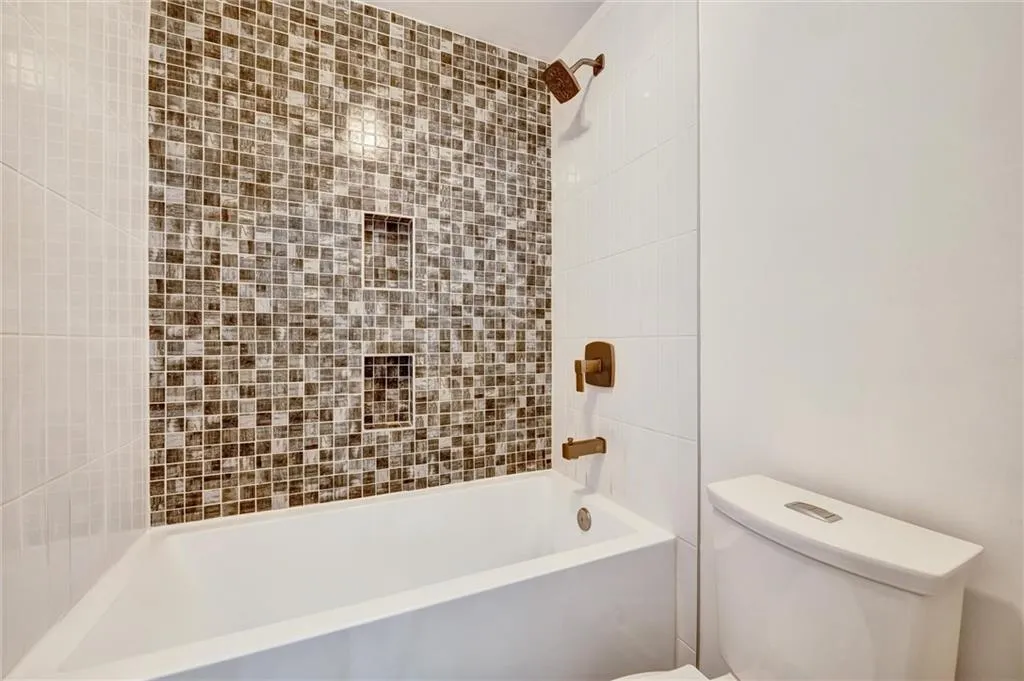 Full bath with washtub / shower combination and toilet