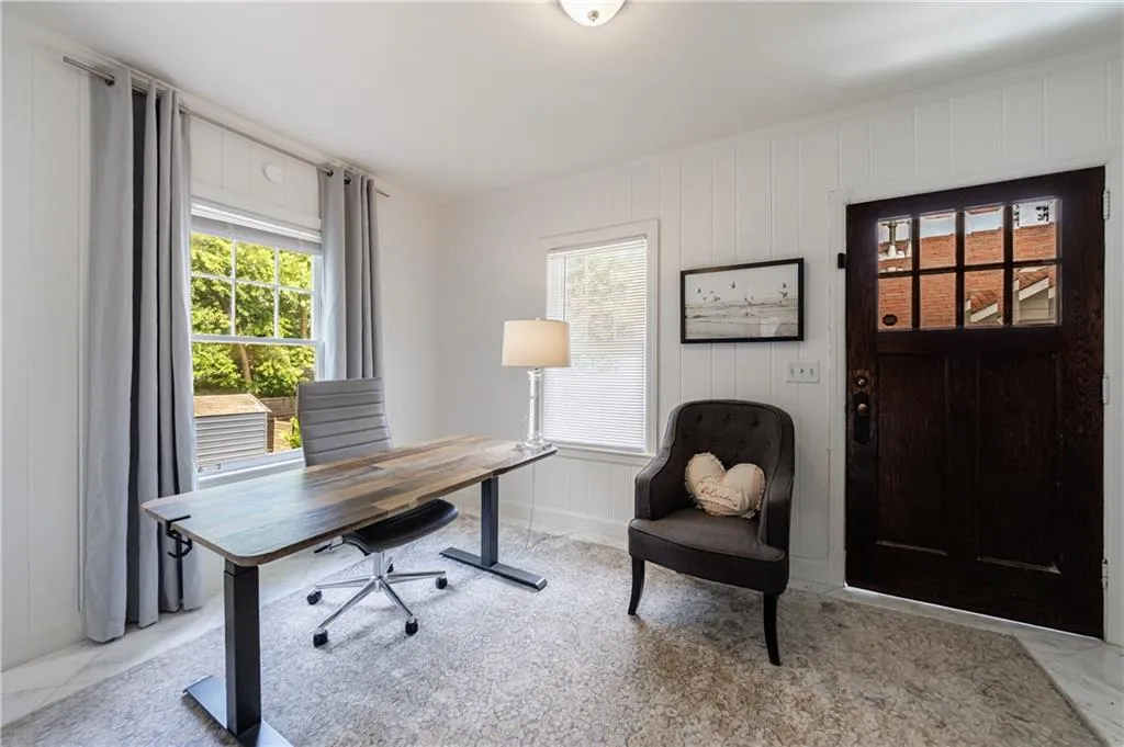 Office with healthy amount of natural light and baseboards