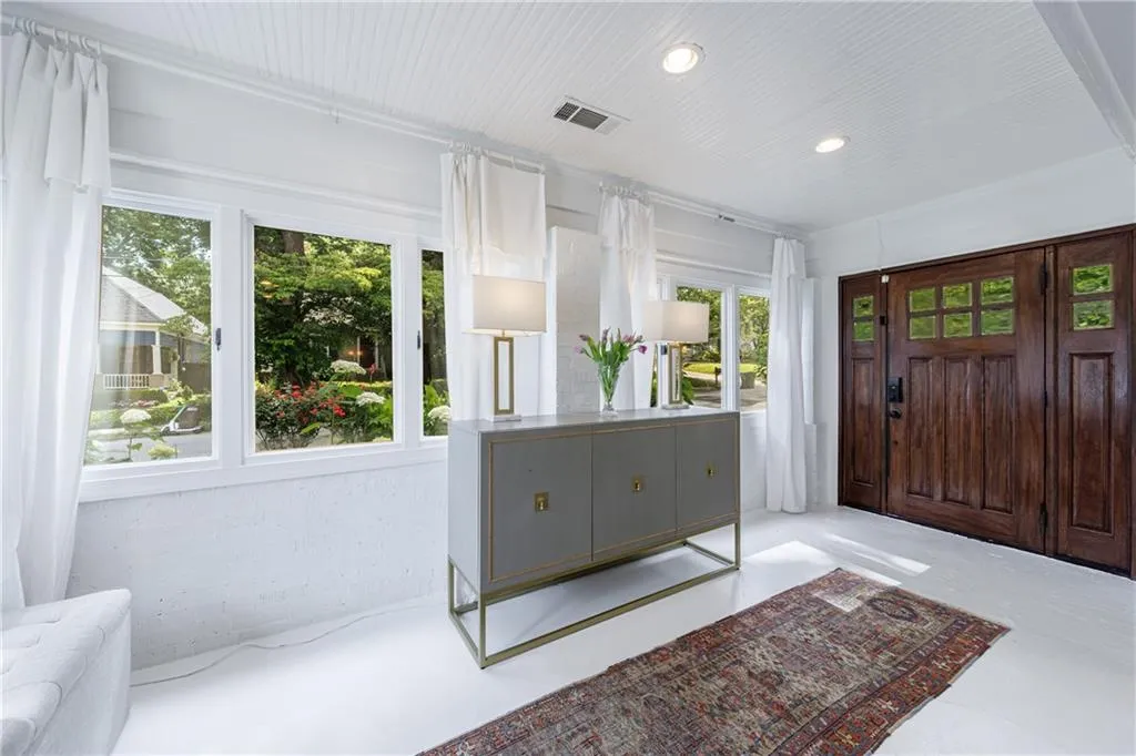 Entrance foyer featuring finished concrete floors and recessed lighting
