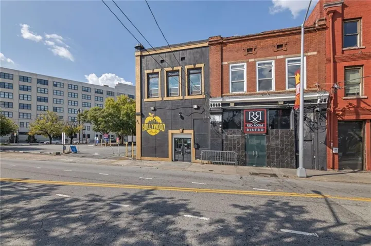 Two-story commercial building with brick and dark facade