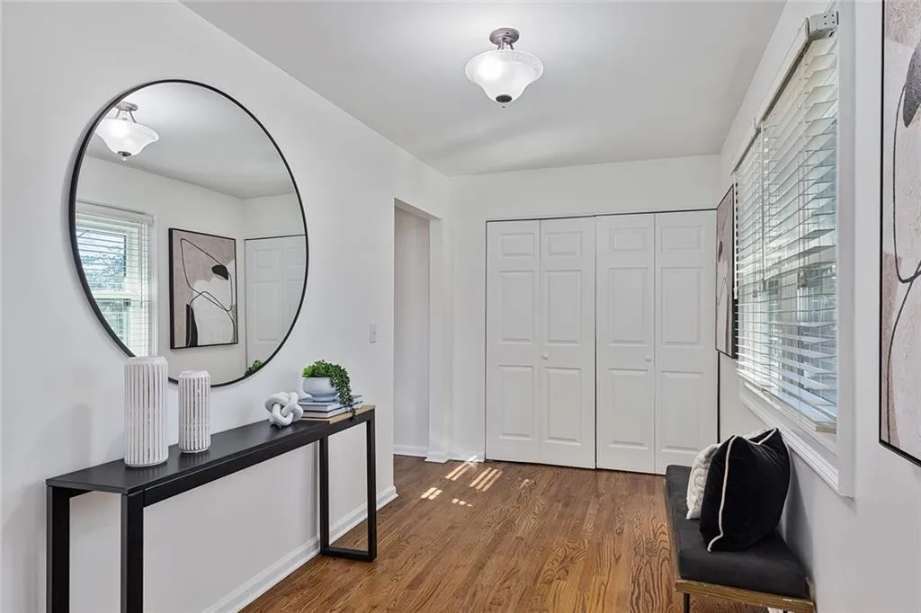 Entrance foyer with wood finished floors and baseboards