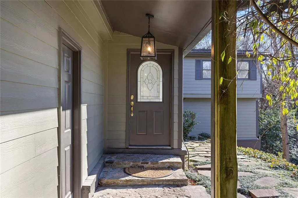 View of exterior entry with covered porch