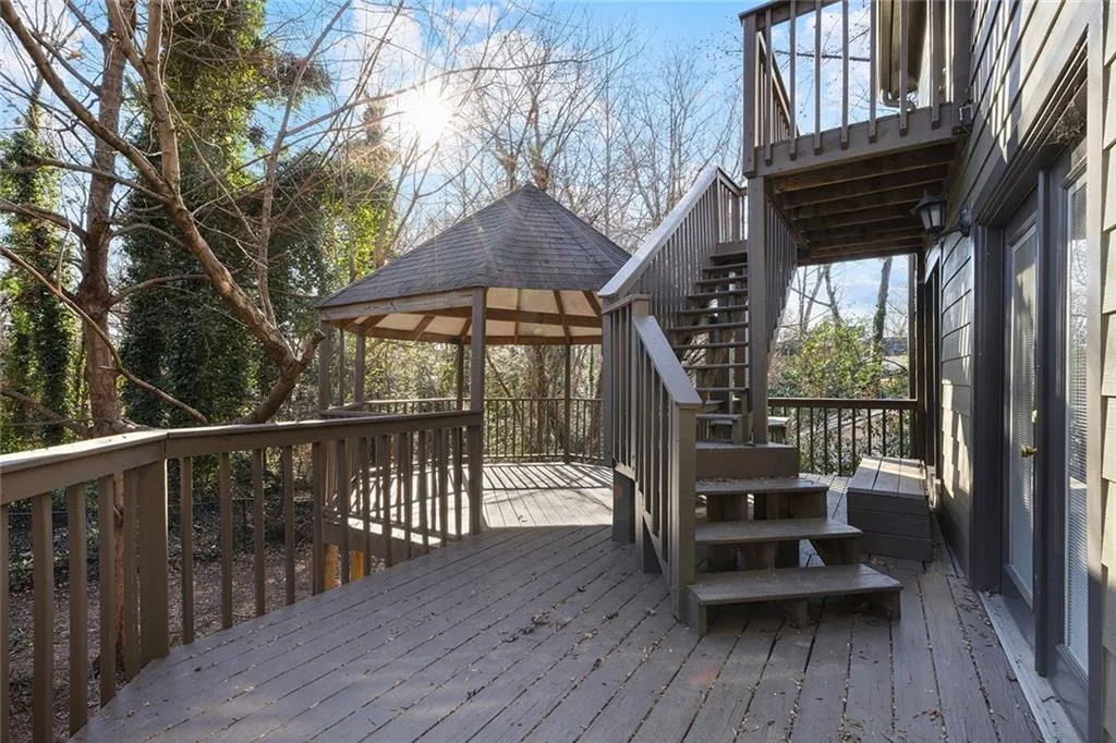 Wooden terrace with stairs and a gazebo