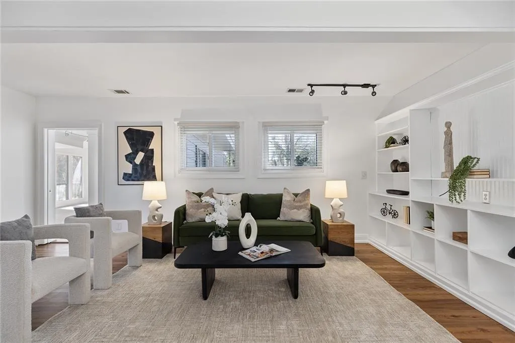 Living area featuring healthy amount of natural light and wood finished floors