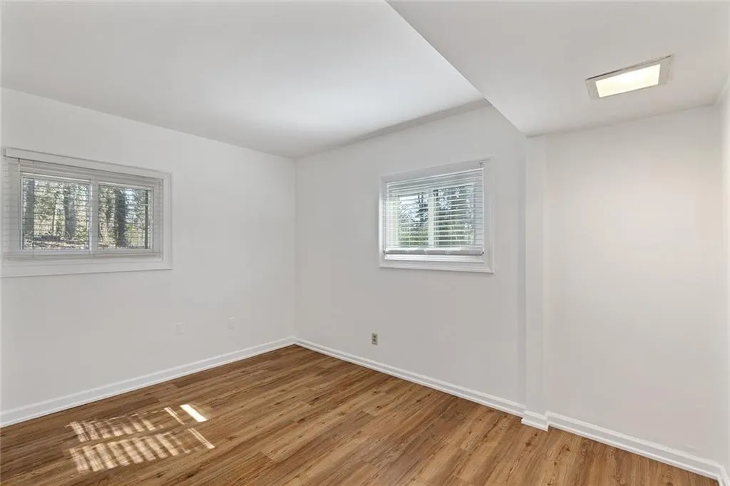 Unfurnished room featuring wood finished floors
