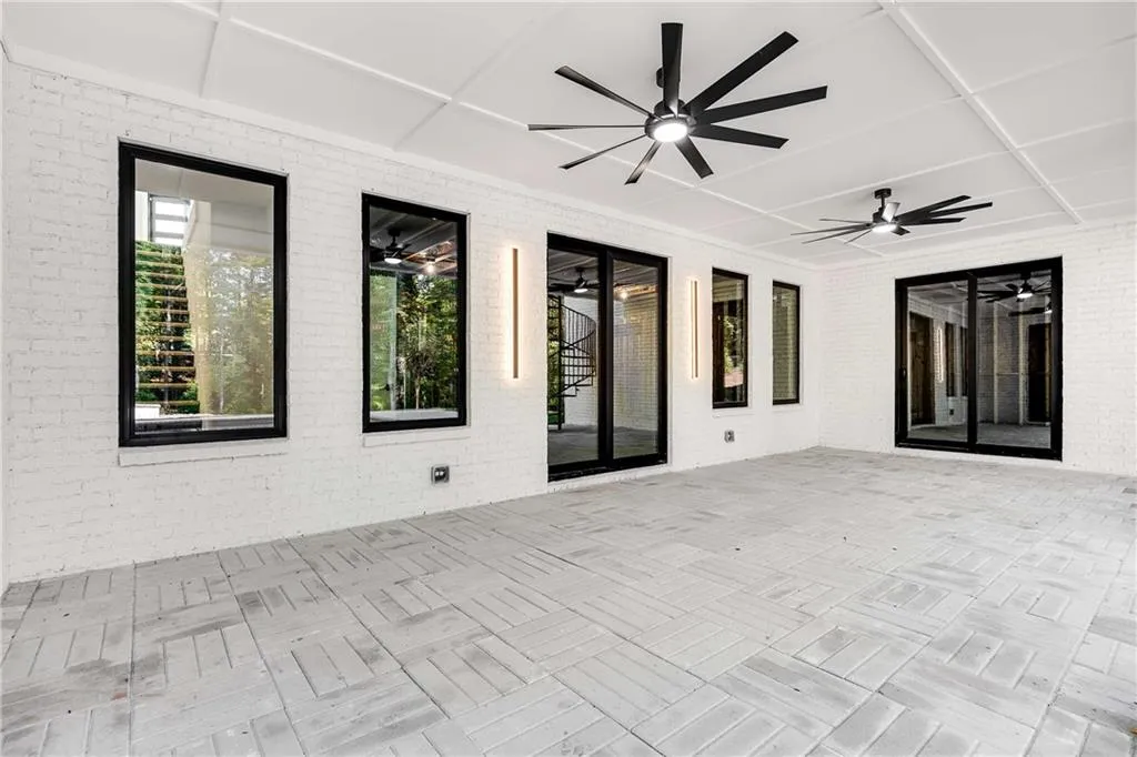 View of patio featuring a ceiling fan