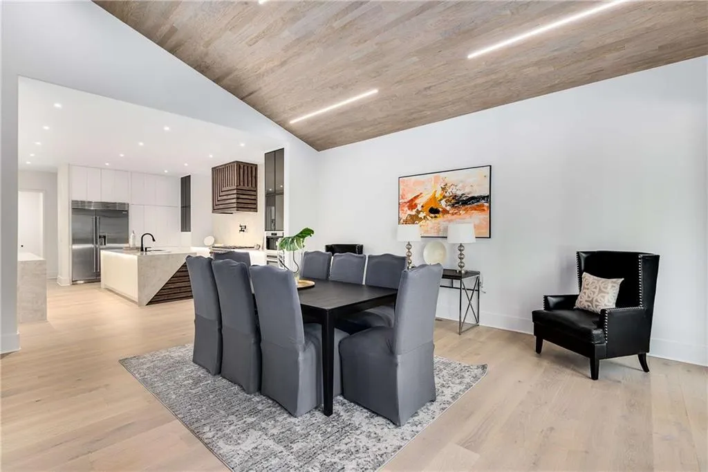 Dining room with light wood finished floors, wood ceiling, recessed lighting, and high vaulted ceiling