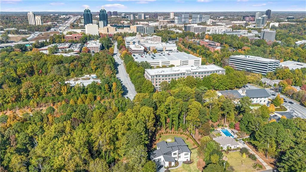 View of property location with nearby urban area