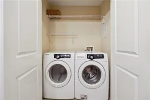 Laundry area featuring washing machine and clothes dryer