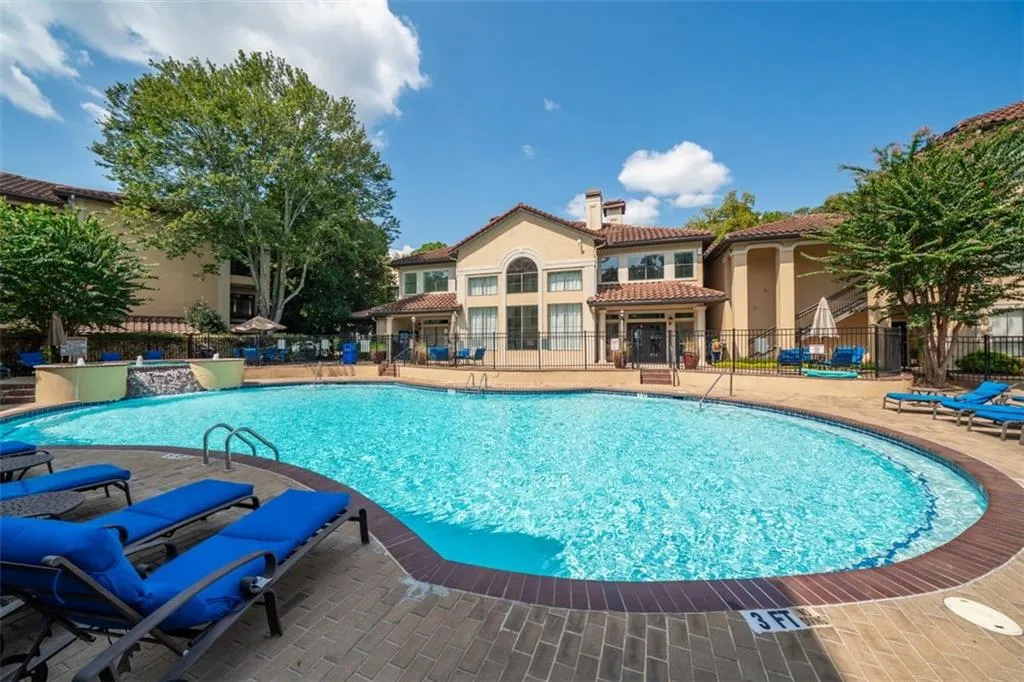 Community pool featuring a patio area