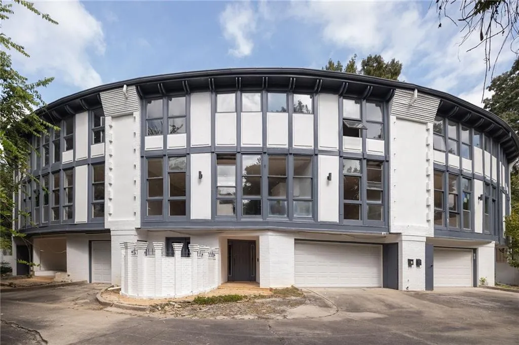 Curved exterior architecture with extensive multi-pane windows