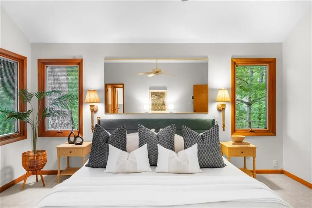 Carpeted bedroom featuring baseboards