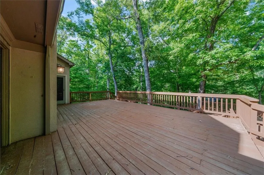 Deck with view of wooded area