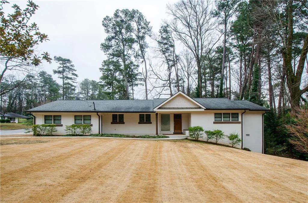 Single story home featuring covered porch
