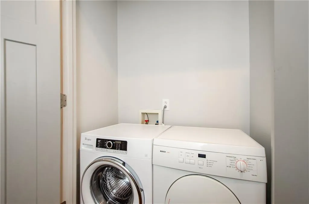 Laundry area featuring independent washer and dryer
