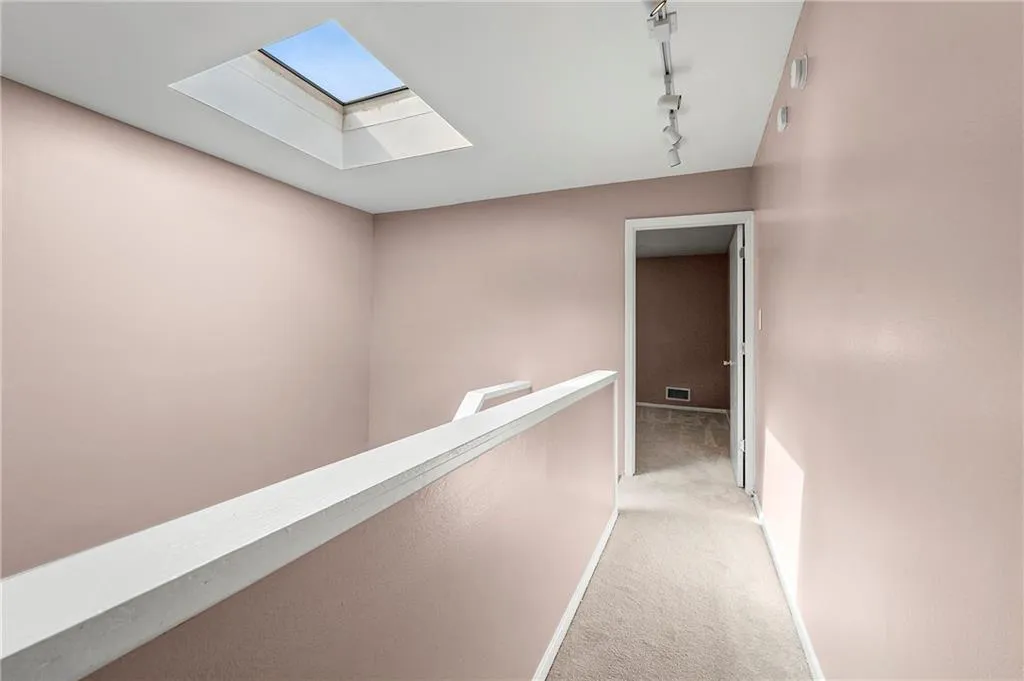 Upstairs hallway with skylight