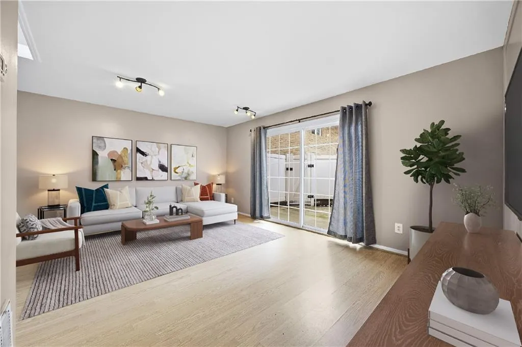 Living area featuring wood finished floors and baseboards