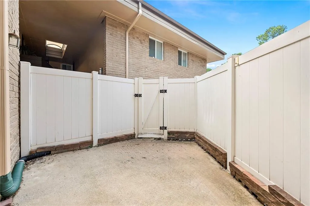 Spacious patio with gate access to parking