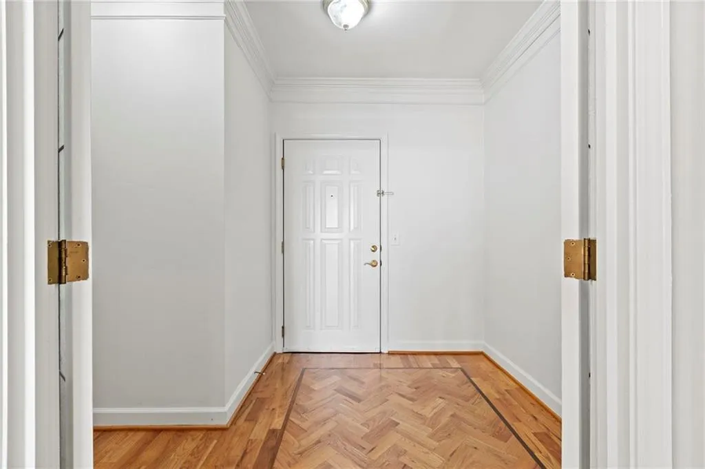 Entrance foyer with herringbone pattern flooring