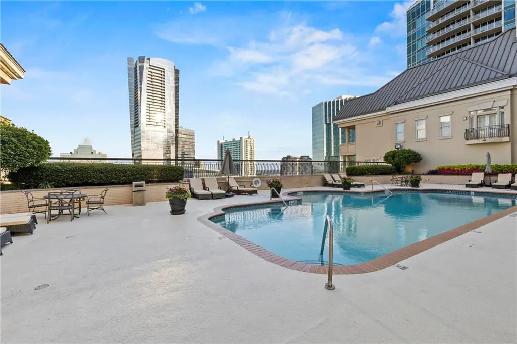 Community pool featuring a patio