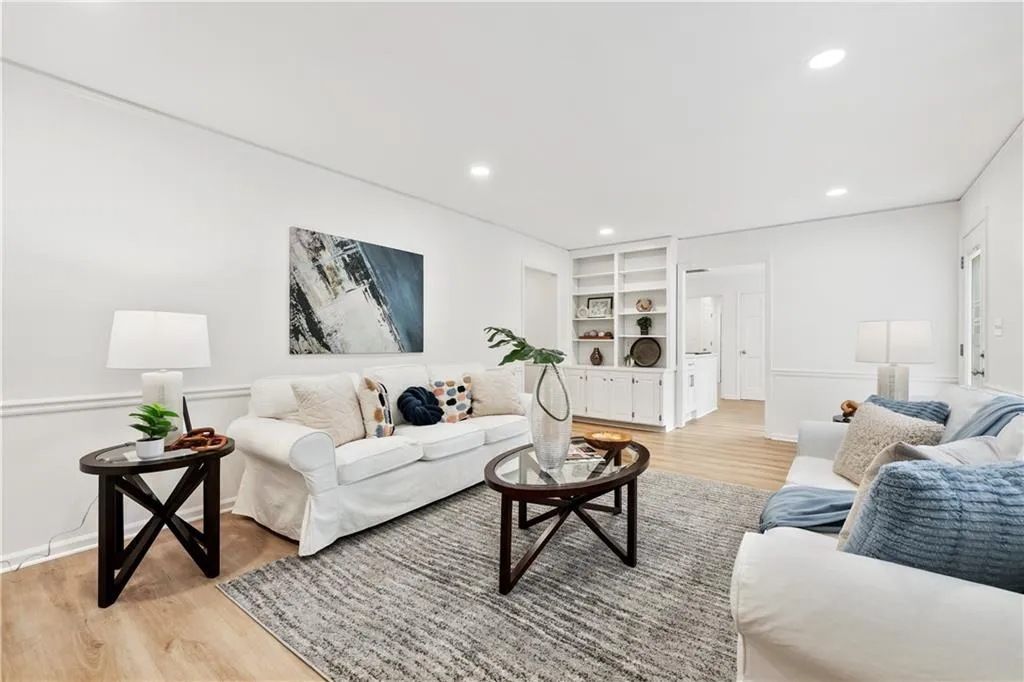Large room for family gatherings.  New lighting, new paint, new flooring.