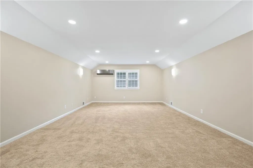Large bonus room could be an office, a play room, or a gym.  New carpet, net lighting, and new paint.