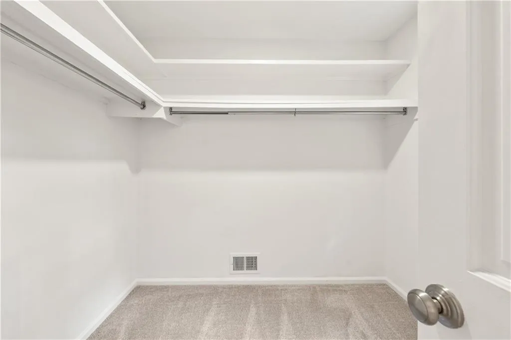 Walk in closet for primary suite.