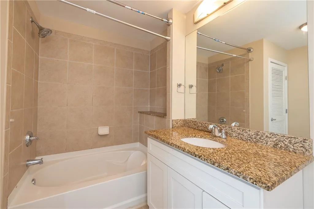 Full bath with generous vanity and tub/shower combination